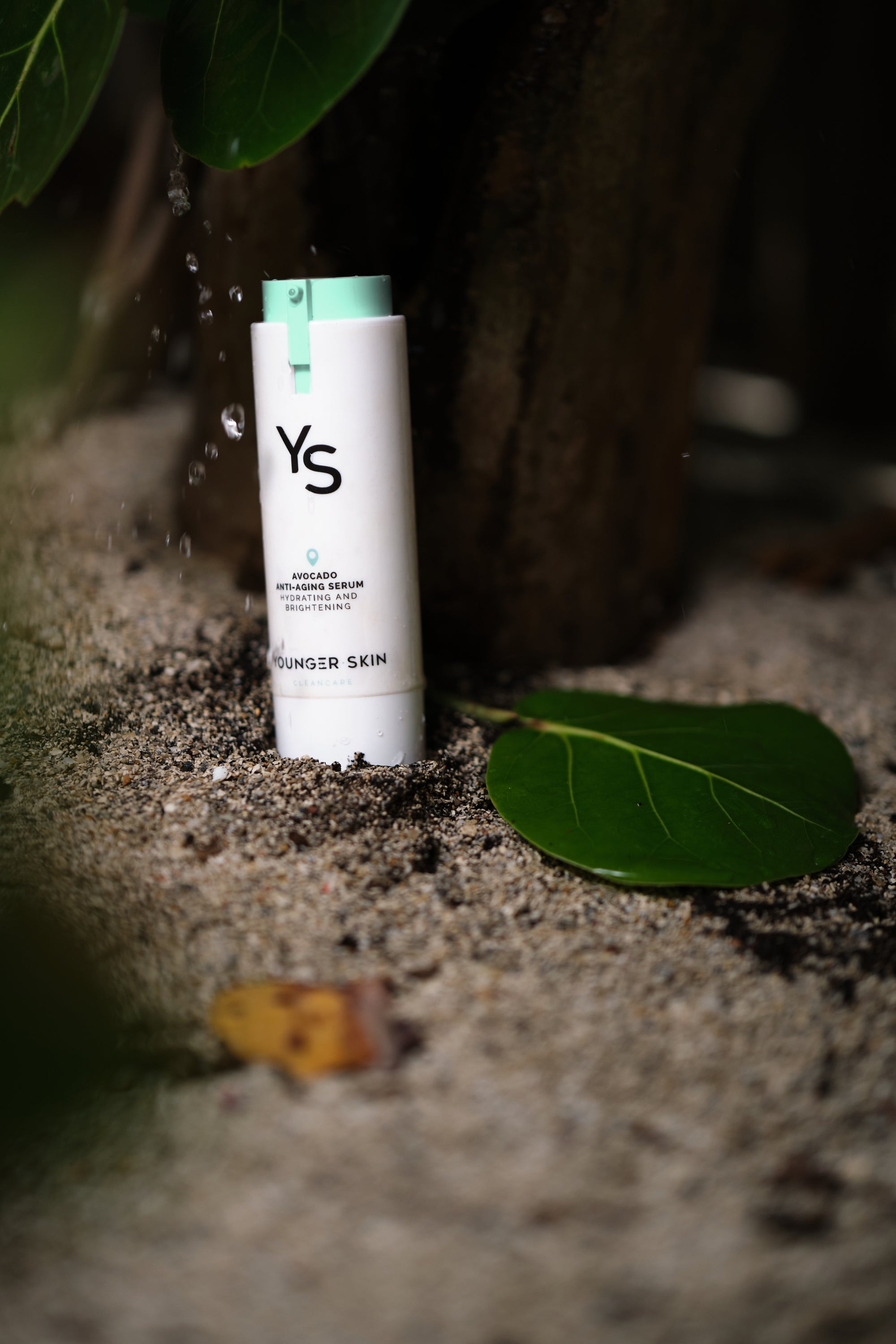 YoungerSkin Product on tropical beach